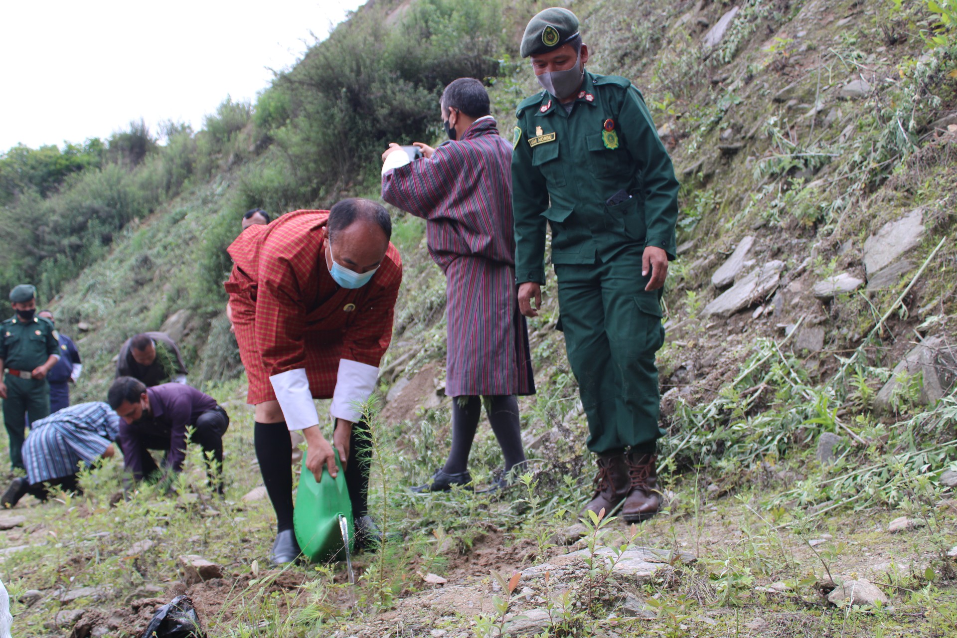 Dzongdag planting a sapling of Bhutan Pine